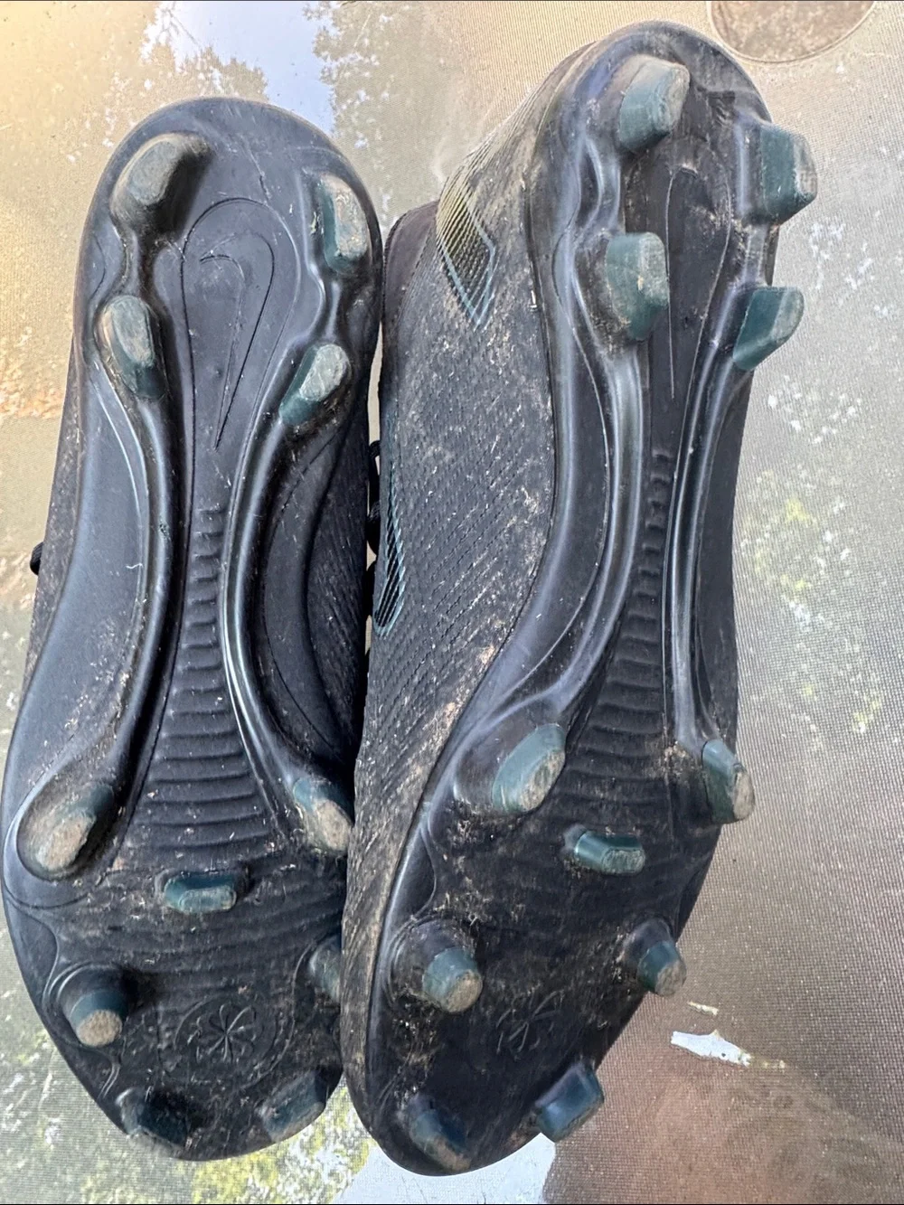 Nike Men’s Black Soccer Cleats with Subtle Blue Swoosh